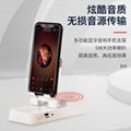 Mobile phone holder with bluetooth speaker