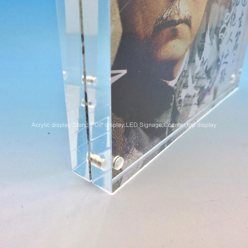 The Heavy Magnetic Picture Frame preserves your photo between heavy sheets of clear acrylic that are held together by magnetic corners. Can be used vertically or horizontally and available in three sizes:2-1/2 X 3-1/2 X 3/4, 3 1/2'', 3 1/2'' x 5'', 4'' x 6'', 5'' x 7''.