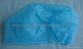 Disposable nonwoven surgical cap