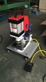 portable grommet attaching machine for