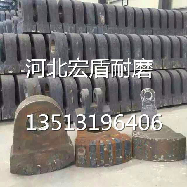 Tungsten titanium alloy hammers with high manganese steel