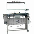 Hand knitting machine with motor