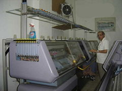 Flat knitting machines