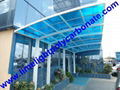 Double aluminium carport with white frame and blue polycarbonate solid roofing 7