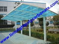 Double aluminium carport with white frame and blue polycarbonate solid roofing