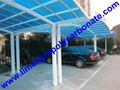 Double aluminium carport with white frame and blue polycarbonate solid roofing