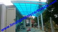 Double aluminium carport with white frame and blue polycarbonate solid roofing 13