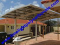 single aluminium awning with white frame and bronze polycarbonate solid roofing