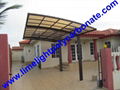 single aluminium awning with white frame and bronze polycarbonate solid roofing