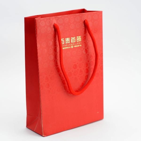 Ivory paper bag with embossed Logo